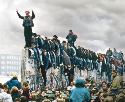 August 12-13, 1961, Berlin, Germany --- Thousands of Germans gather to celebrate the demise of Communism with the symbolic fall of the Berlin Wall. --- Image by © Regis Bossu/Sygma/Corbis